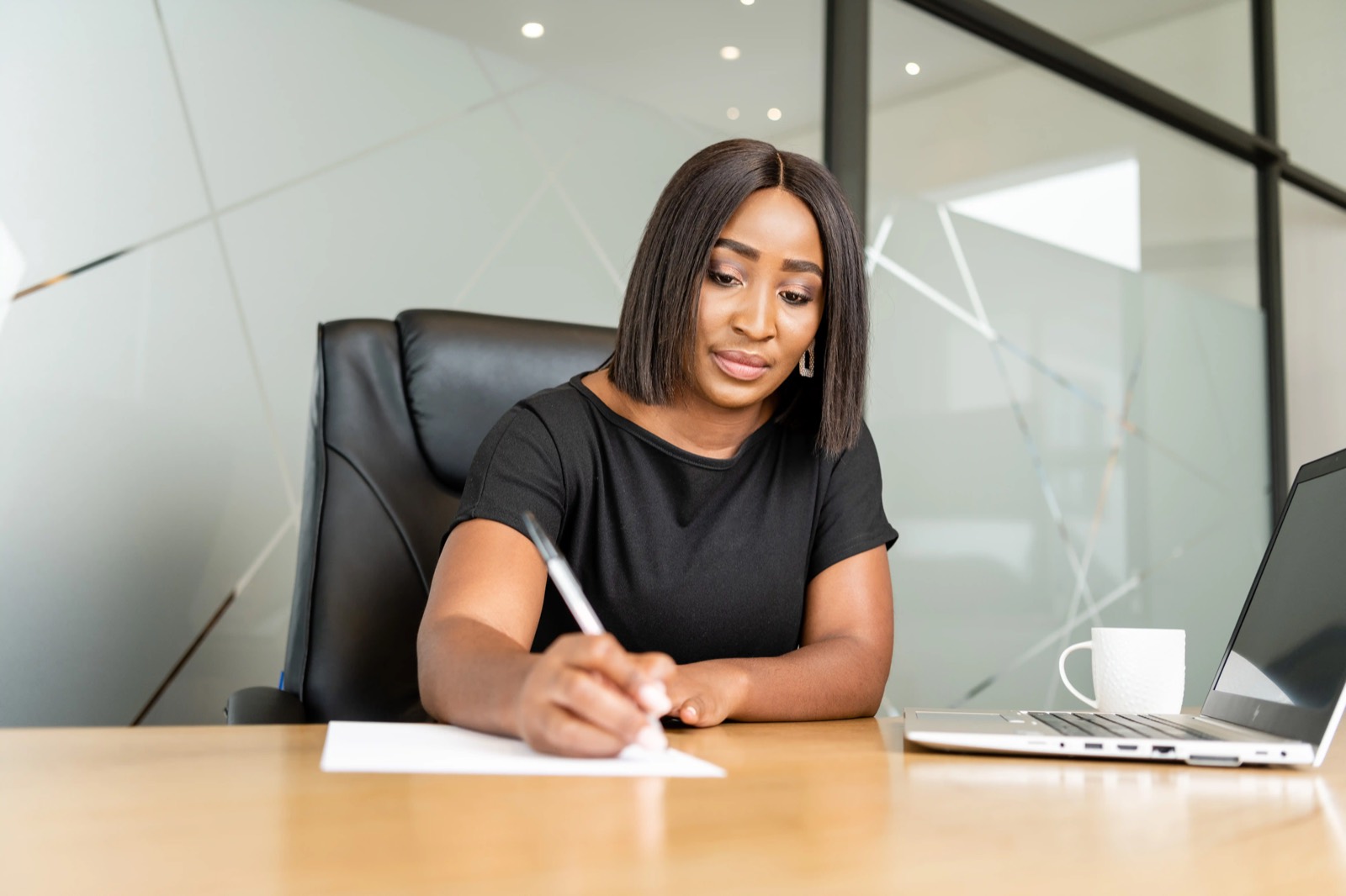 A Potentia colleague making notes at a desk